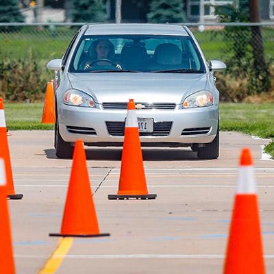 car driving around cones for drivers education